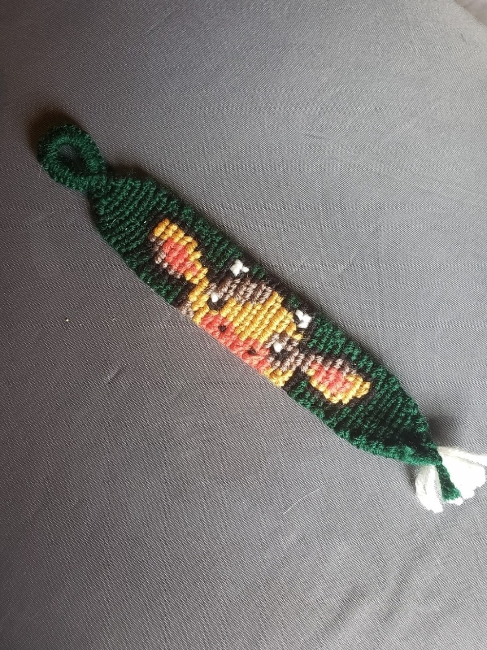 Handwoven Green Bracelet with Red & Yellow Cow Accent
